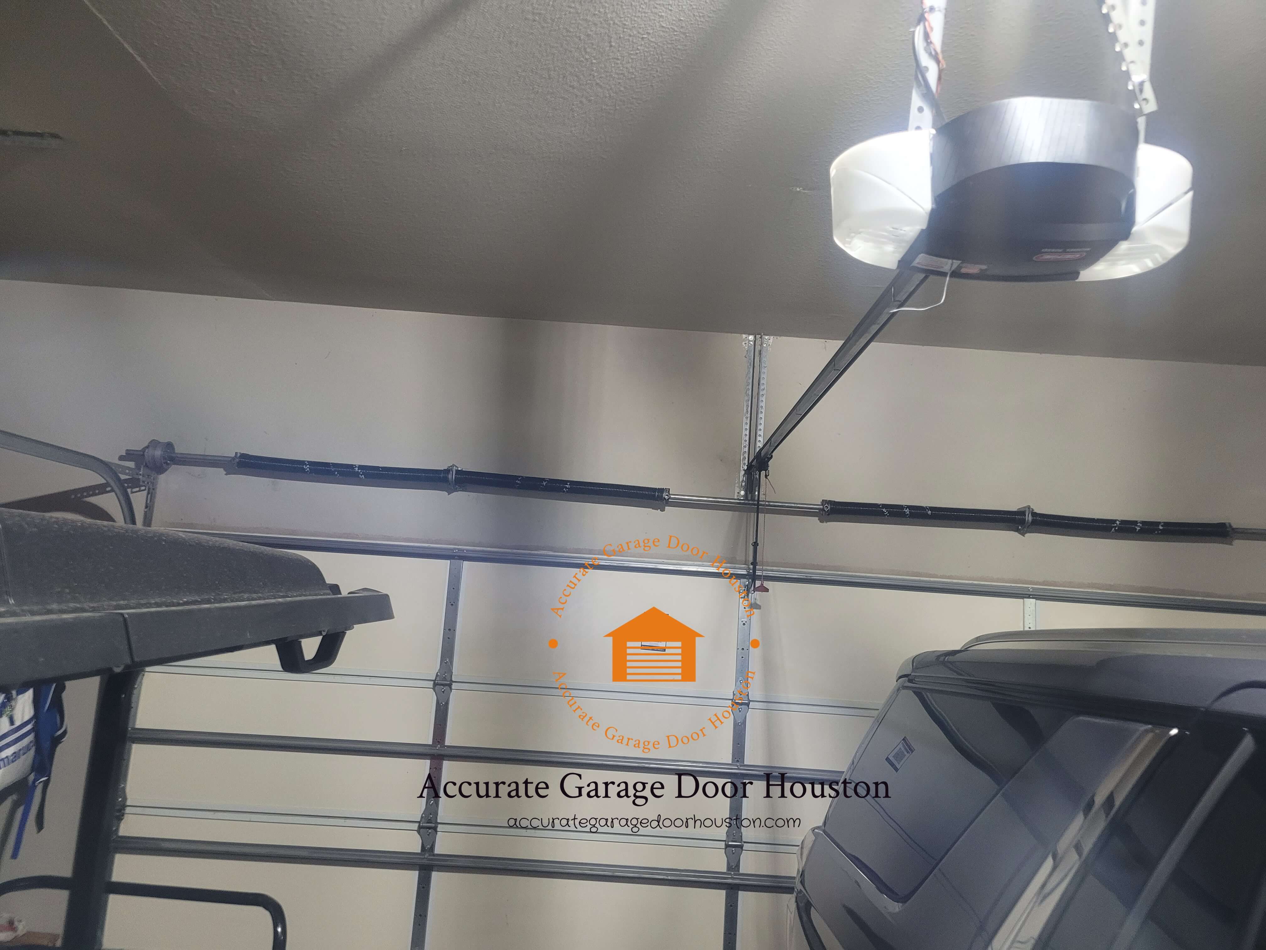 accurategaragedoorhouston.com_4_garage_door_torsion_spring_syetem_replacement